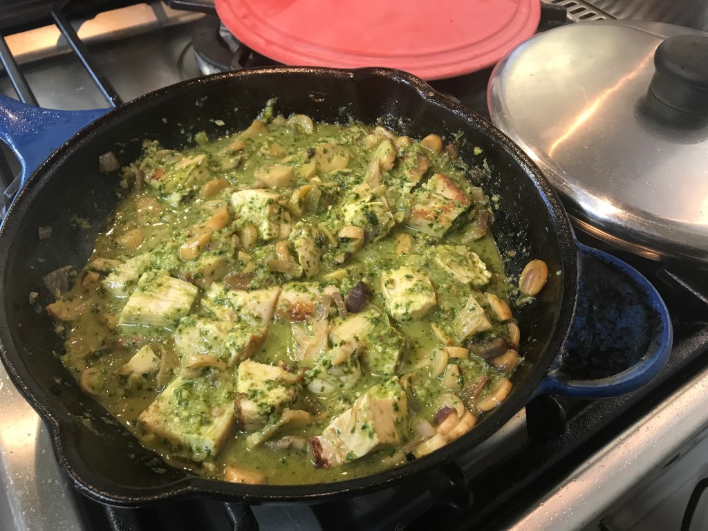 oyster mushroom and pesto sauce cooking