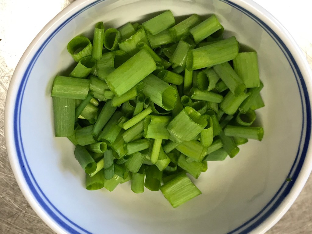 Chopped green tops of spring onion and chives